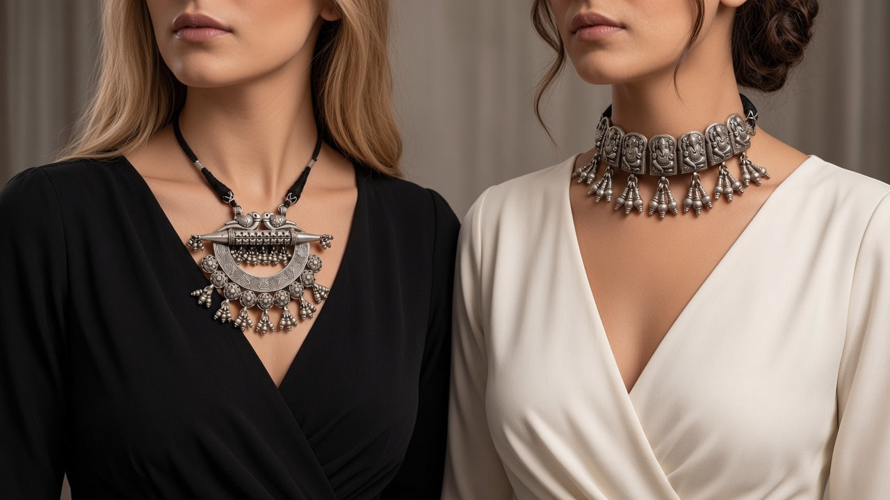 Two women wearing the crescent necklace and the Ganesha choker